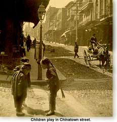 children play in a Chinatown street