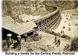 Chinese laborers build Central Pacific Railroad trestle in the Sierra